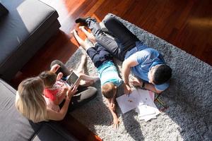 young couple spending time with kids top view photo