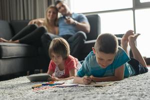 young couple spending time with kids photo