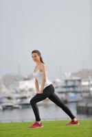 Young beautiful  woman jogging  on morning photo