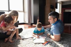 young couple spending time with kids photo