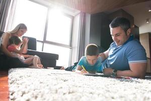 young couple spending time with kids photo