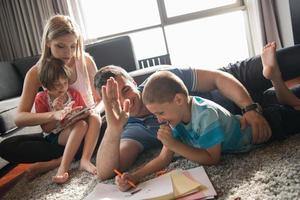 young couple spending time with kids photo