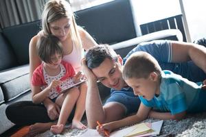 young couple spending time with kids photo