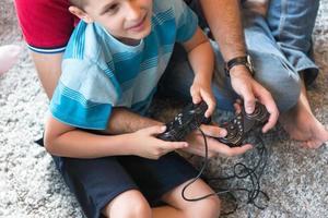 Happy family playing a video game photo