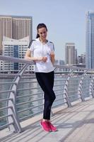 Young beautiful  woman jogging  on morning photo