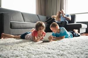 young couple spending time with kids photo