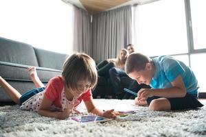 young couple spending time with kids photo