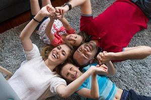 happy family lying on the floor photo