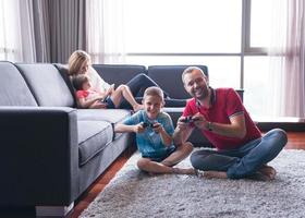 Happy family playing a video game photo