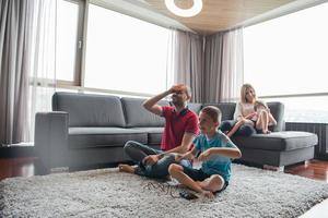 Happy family playing a video game photo