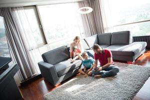 Happy family playing a video game photo