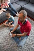 Happy family playing a video game photo