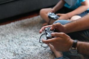 Happy family playing a video game photo