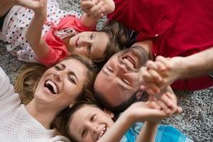 happy family lying on the floor photo