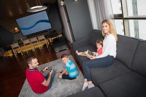 Happy family playing a video game photo