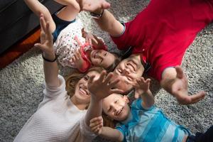 happy family lying on the floor photo