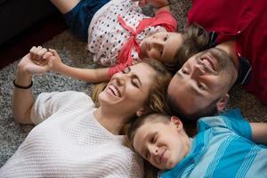 happy family lying on the floor photo