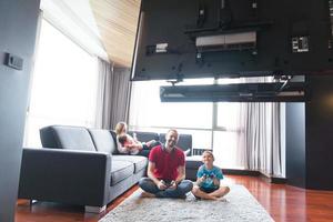 Happy family playing a video game photo