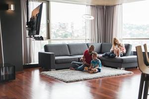 Happy family playing a video game photo