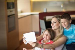 Young Family Using A Tablet To Make Future Plans photo