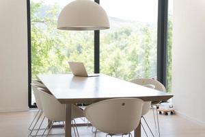 laptop on a kitchen table photo