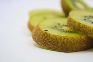 beautiful kiwi fruit slices on white background photo