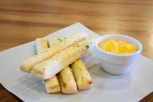 Fresh golden, cheesy breadsticks photo