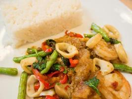 Rice with stir-fried seafood and basil photo