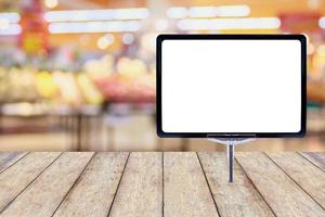 Blank price board with fresh food in supermarket abstract blurred background with bokeh light photo