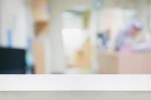 Empty white counter with blur hospital background photo