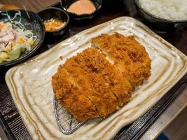 Fried pork cutlet with cheese filling photo
