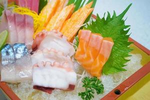 japanese sashimi set on boat plate photo