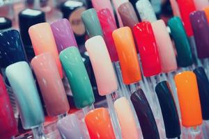 colorful artificial nails in beauty shop photo