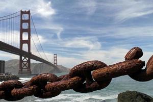 Rusty chain with Golden Gate Bridge in the background photo