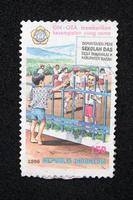 Sidoarjo, Jawa timur, Indonesia, 2022 -  philately with the theme of an illustration of a boy wanting to learn photo