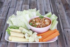 Crab's Spawn Chili Sauce with vegetables is a Thai food style. photo