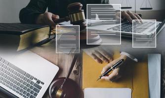 Male lawyer working with contract papers and wooden gavel on tabel in courtroom. justice and law ,attorney, court judge, concept. photo