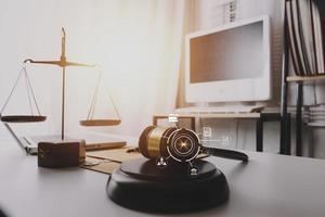 Business and lawyers discussing contract papers with brass scale on desk in office. Law, legal services, advice, justice and law concept picture with film grain effect photo