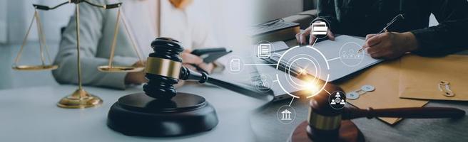 Justice and law concept. Gavel on sounding block in hand's Male judge at a courtroom, working with document law books, report the case on table in modern office. photo