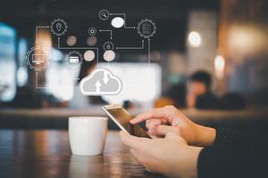 Man use mobile smartphone with cloud computing diagram show on hand. Cloud technology. Data storage. Networking and internet service concept. photo