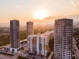 Tbilisi, Georgia,2021 - Green diamond apartments complex buildings panorama with sunny sunset background. Georgia real estate property business industry concept