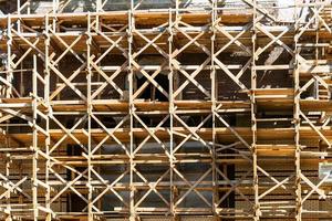 wooden scaffolds on multi-storey building photo