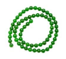 string of beads from green nephrite gemstones photo