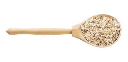 wooden spoon with raw four cereal flakes isolated photo