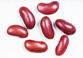 several raw kidney beans close up on gray photo
