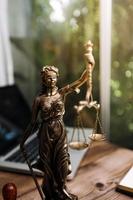 justice and law concept.Male judge in a courtroom on wooden table and Counselor or Male lawyer working in office. Legal law, advice and justice concept. photo