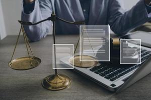 Male lawyer working with contract papers and wooden gavel on tabel in courtroom. justice and law ,attorney, court judge, concept. photo