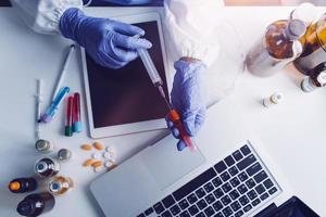 Medicine doctor hand working on a patients x-ray scans digital healthcare and connection with modern virtual screen interface icons, Medical technology and network concept. photo
