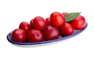 Damson plum in a bowl on white background photo