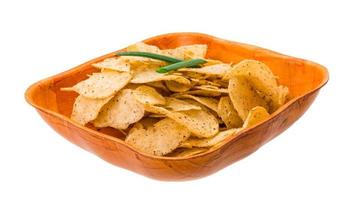 Potato chips in a bowl on white background photo